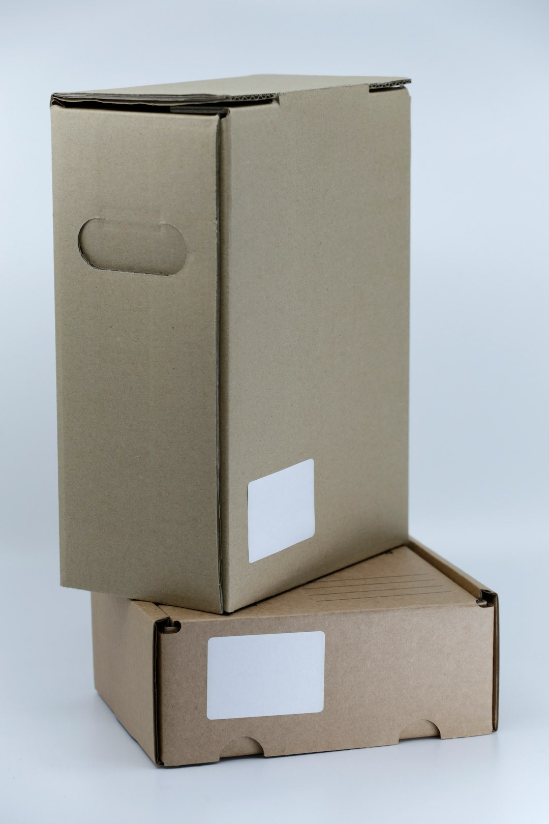 gray-cardboard-box-on-white-table-giz7jkt30rk